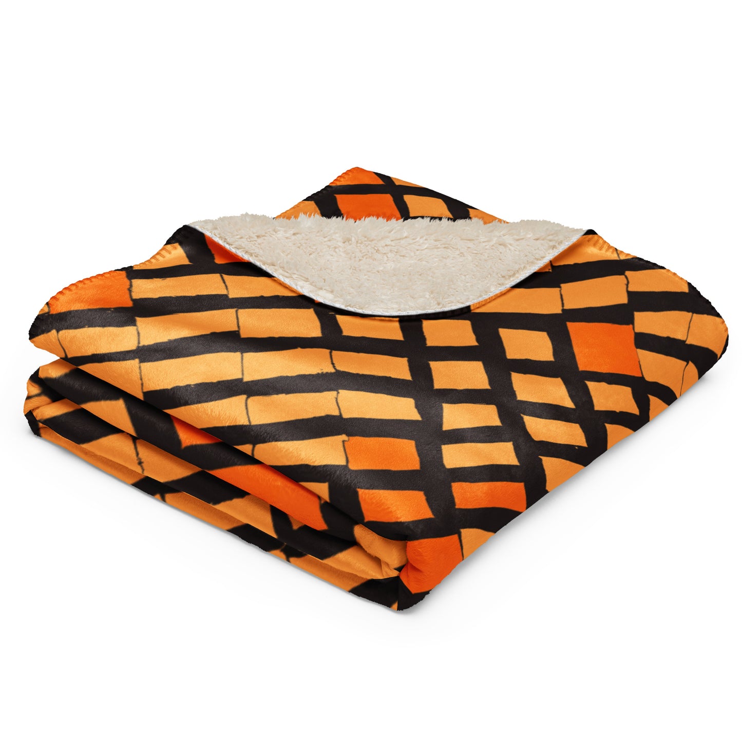 The Lagos Sherpa blanket from Tintin Studios folded neatly to display its unique abstract patterns and luxurious sherpa underside, offering a glimpse of its artful allure and plush comfort.