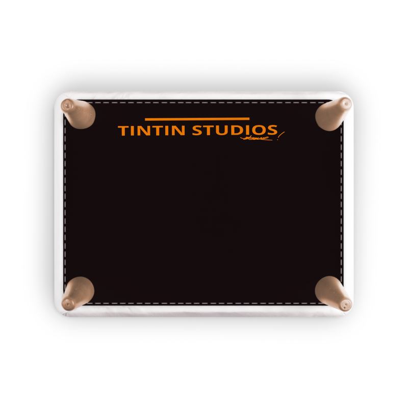 Underside view of the NANA Artigianale Foot Stool displaying the Tintin Studios logo, showcasing the meticulous craftsmanship and high-quality standards of the brand.