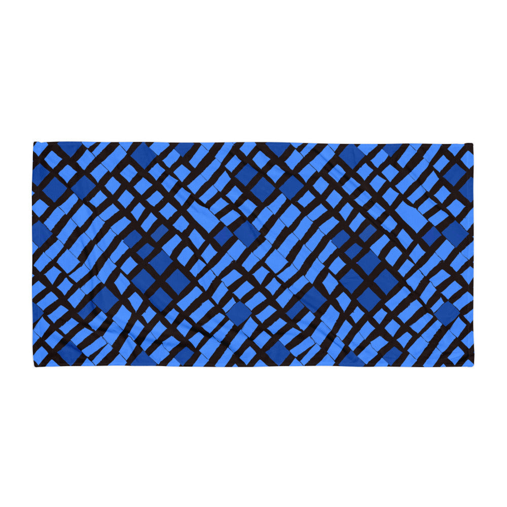 Blue Lagos beach towel from Tintin Studios laid flat on a white background, emphasising its clean, minimalistic appeal.