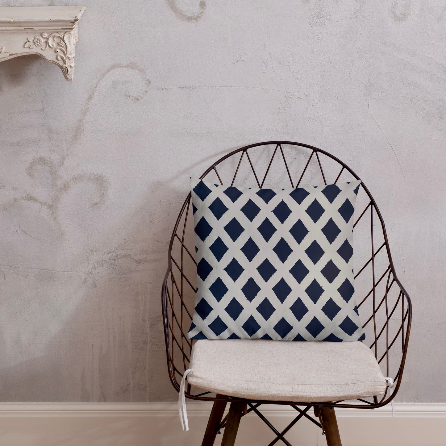 18x18 Zaria blue throw pillow from Tintin Studios, minimalist and calming on a black iron chair.