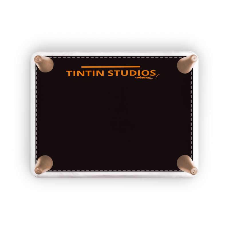 Underside view of the NANA Artigianale Foot Stool displaying the Tintin Studios logo, showcasing the meticulous craftsmanship and high-quality standards of the brand.